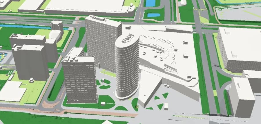 Het ovale landmarkmodel van Oval Tower tussen de gebouwen van Amsterdam Zuidoost